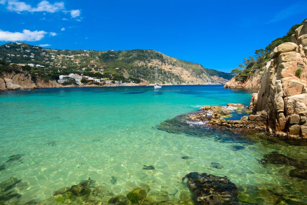 Platja d'Aiguablava turquoise cove with golden sand in Begur, Girona
