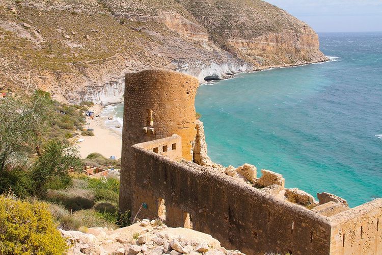 Cala de San Pedro cove with the ruins of the 15th-century castle in Cabo de Gata-Níjar Natural Park