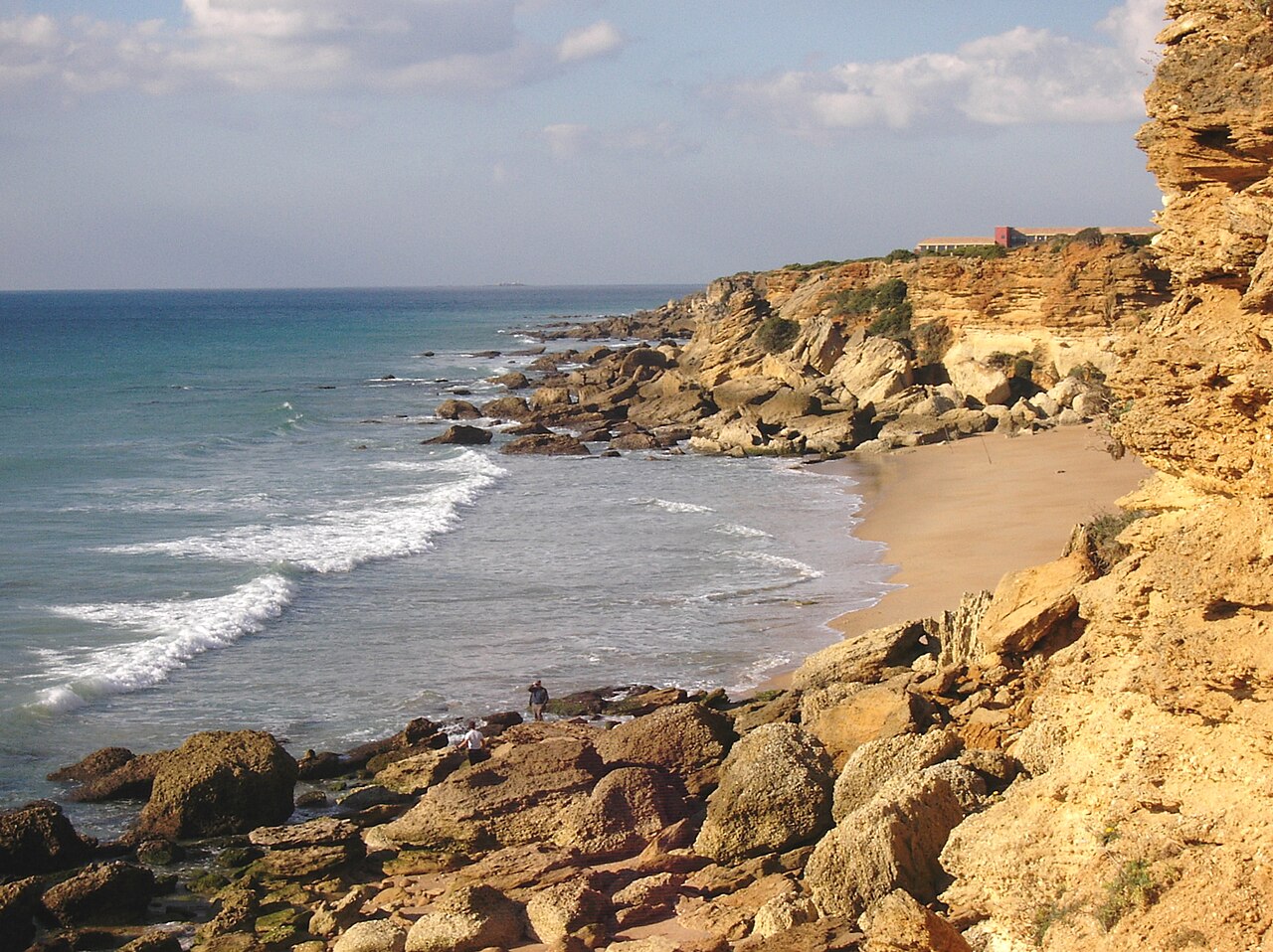 Cala de Roche sheltered beneath its cliffs, Conil de la Frontera