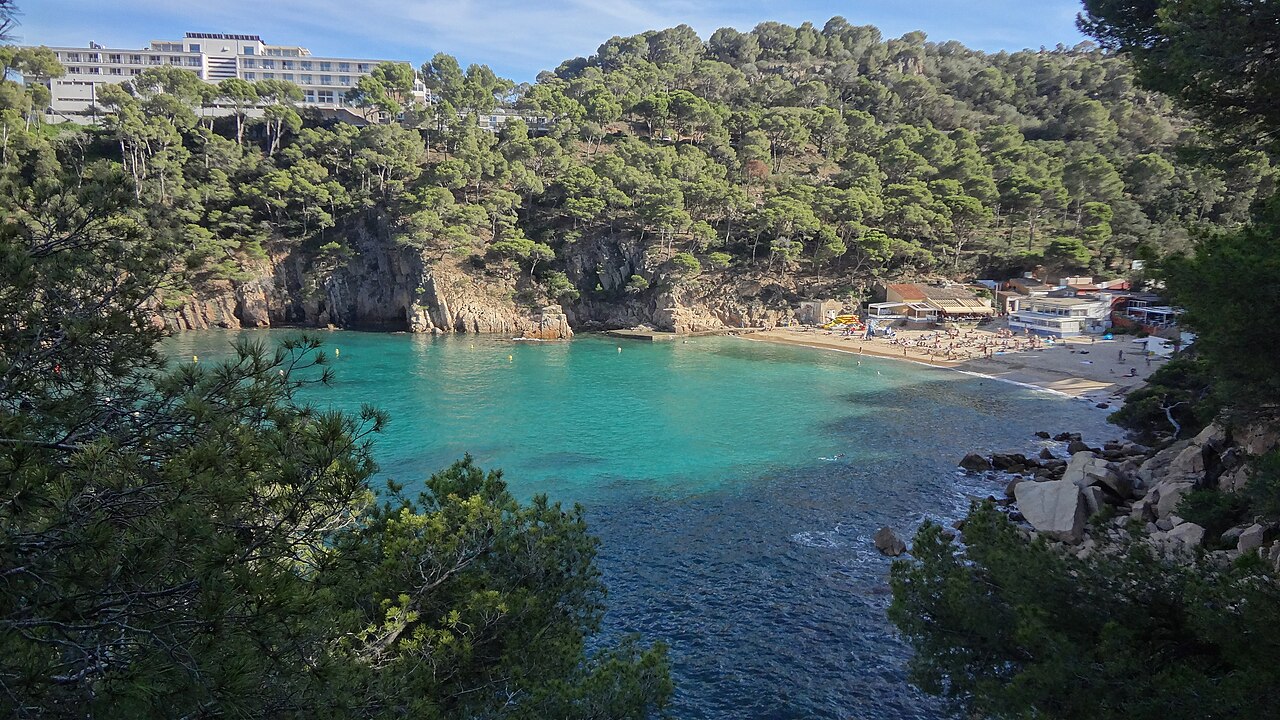 Platja d'Aiguablava in Begur, a golden sand cove with clear turquoise water on the Costa Brava