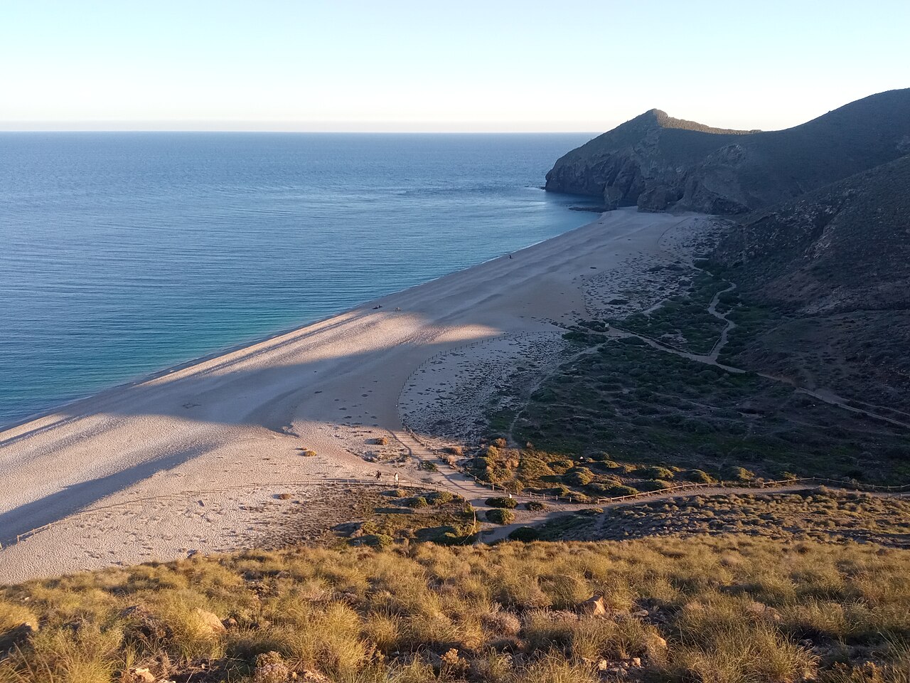 The white pebble shore and turquoise water of Playa de los Muertos, Carboneras, Almería